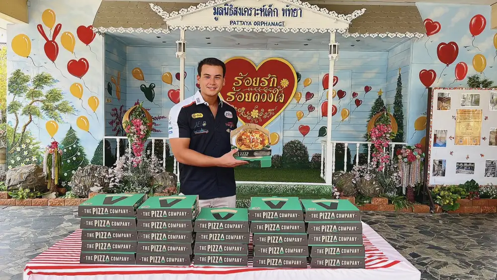 Sandy shares Pizza with children at Pattaya Orphanage on his birthday