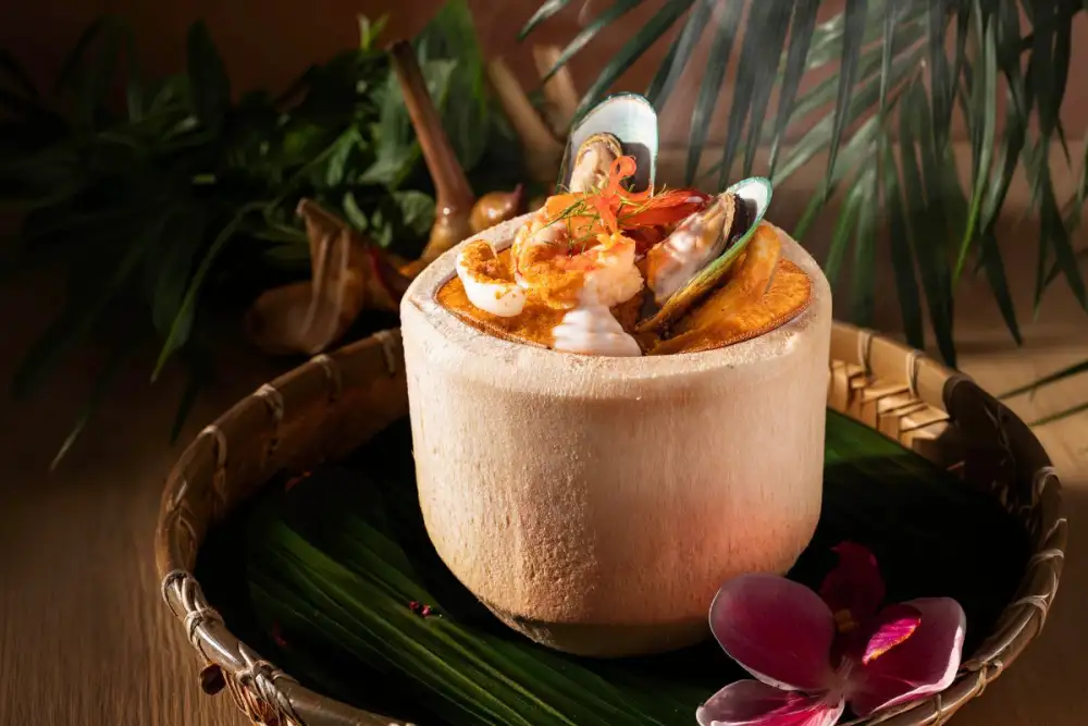 Experience Authentic Thai Flavours with Steamed Seafood Curry Custard in Young Coconut at Plate Restaurant